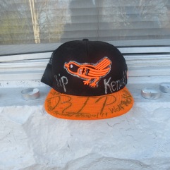 Orioles and Ravens hats were decorated in memory of Fenwick and placed along his porch.